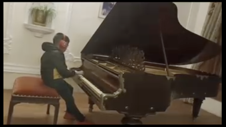 Anwit performing instrumental music on keyboard as part of a musician duo