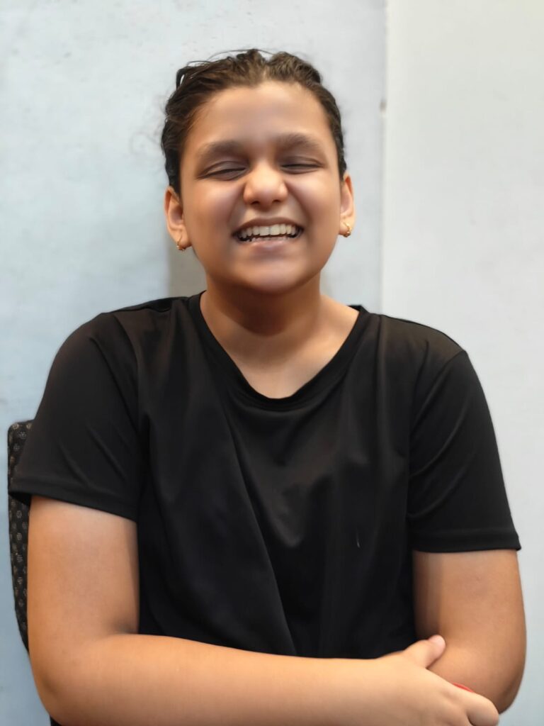 Guitarist Ishi Garg performing live, playing acoustic guitar with expressive style — young talented musician, indie guitarist, music performance photo.