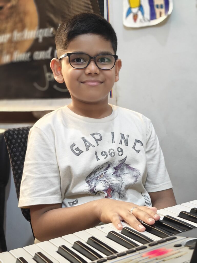 Anwit playing keyboard with skilled technique, expressive melodies, and focused musical performance.