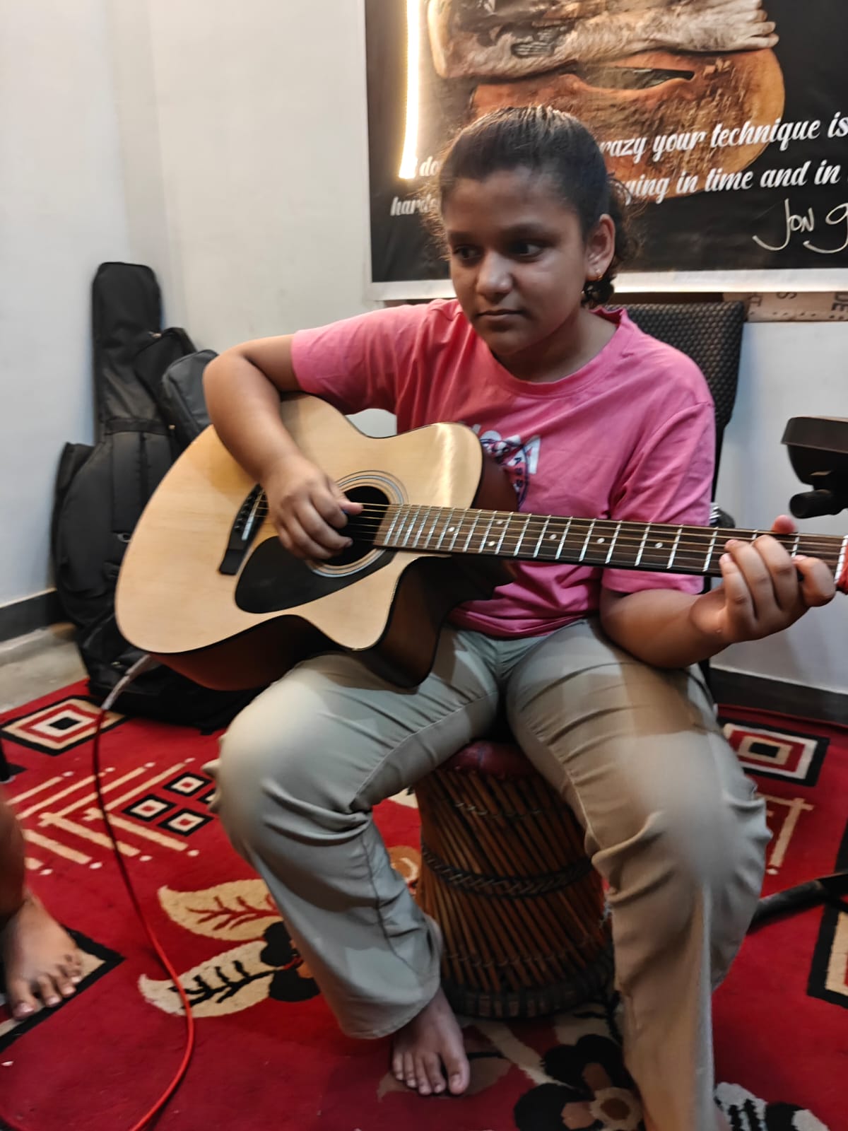 Gallery Ishi delivering soulful acoustic guitar melodies with precision, rhythm, and artistic expression.