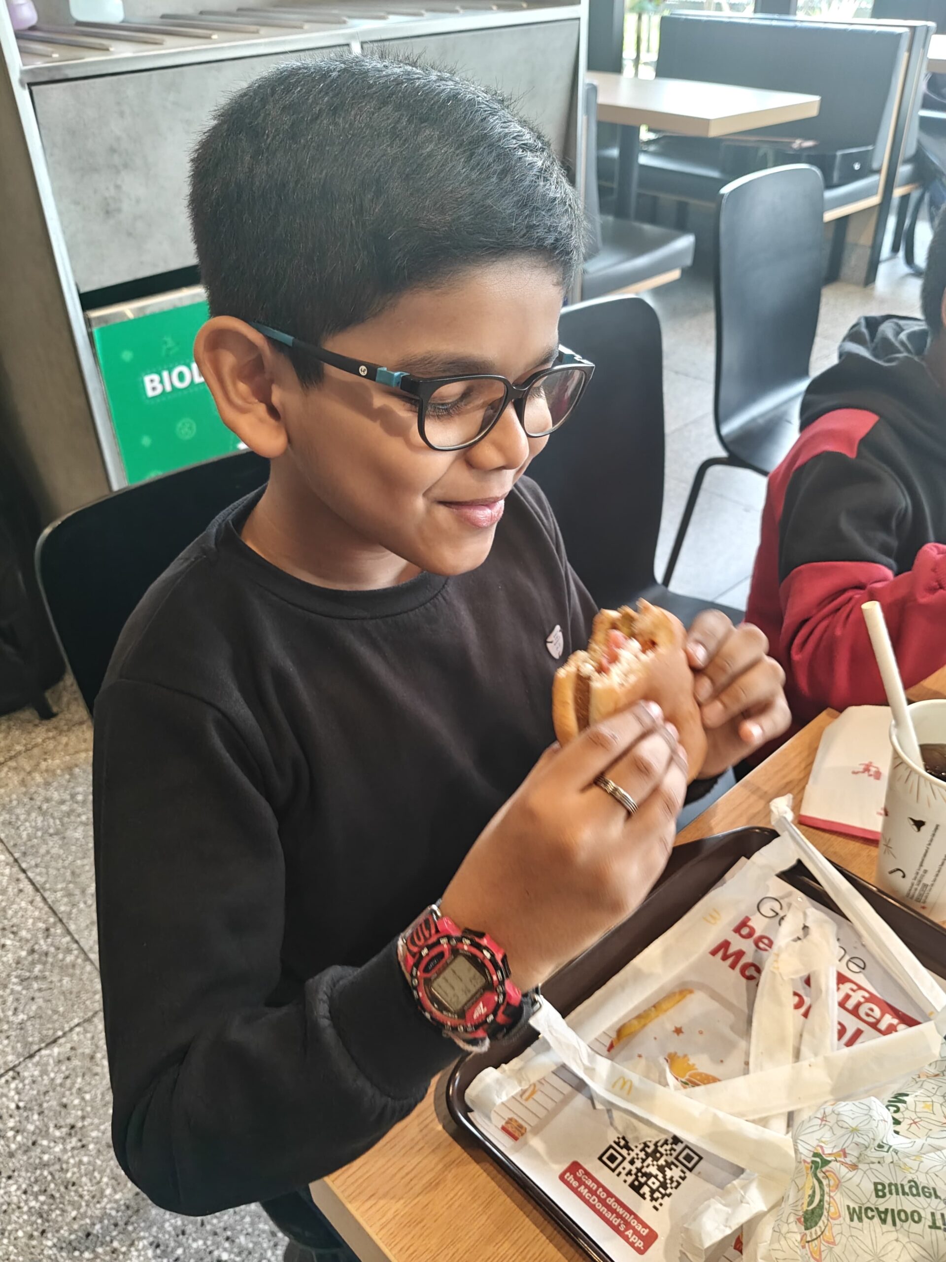 Anwit savoring a McDonald’s burger
