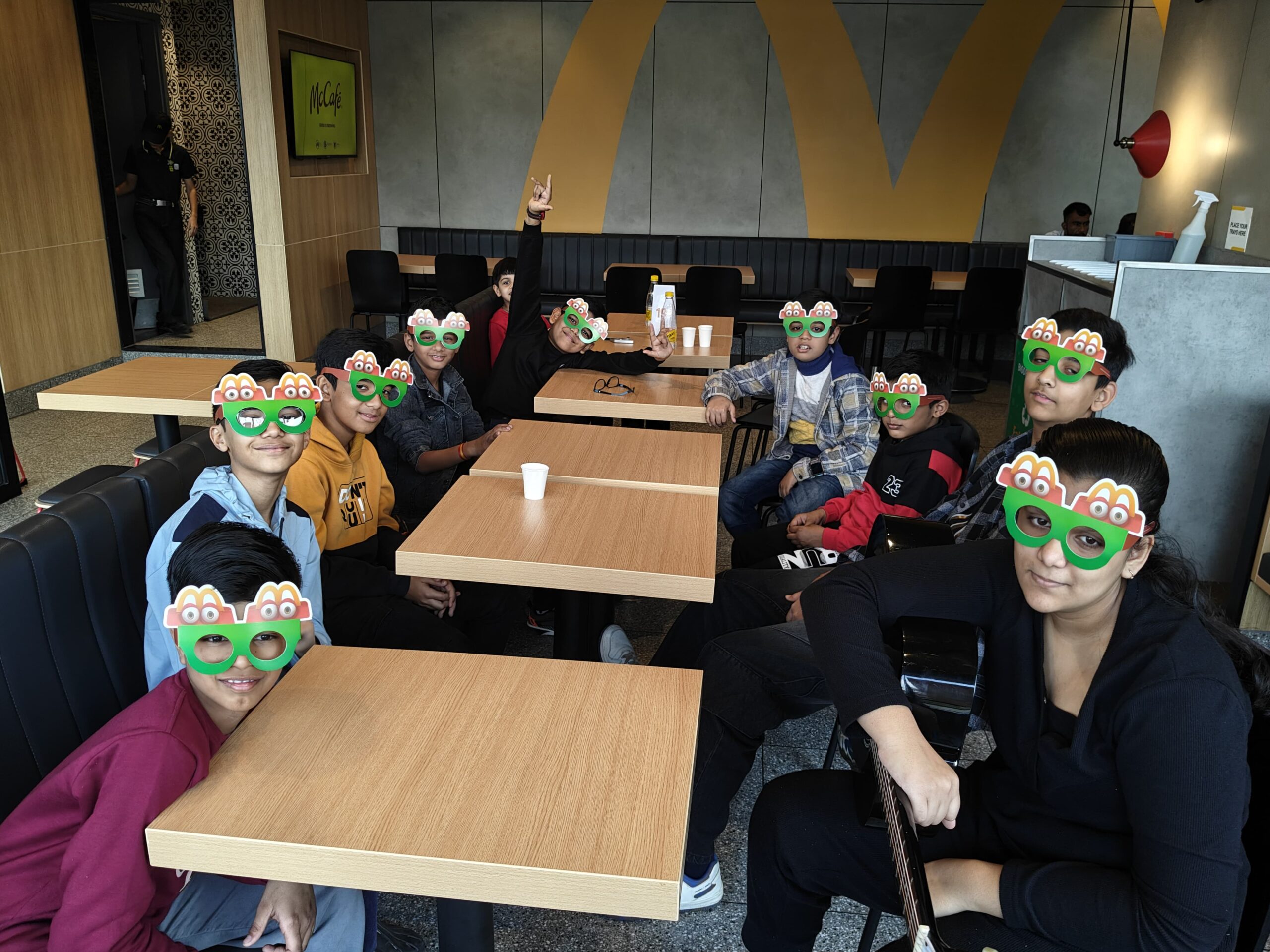 Ishi and friends having a playful music session at McDonald’s cafe