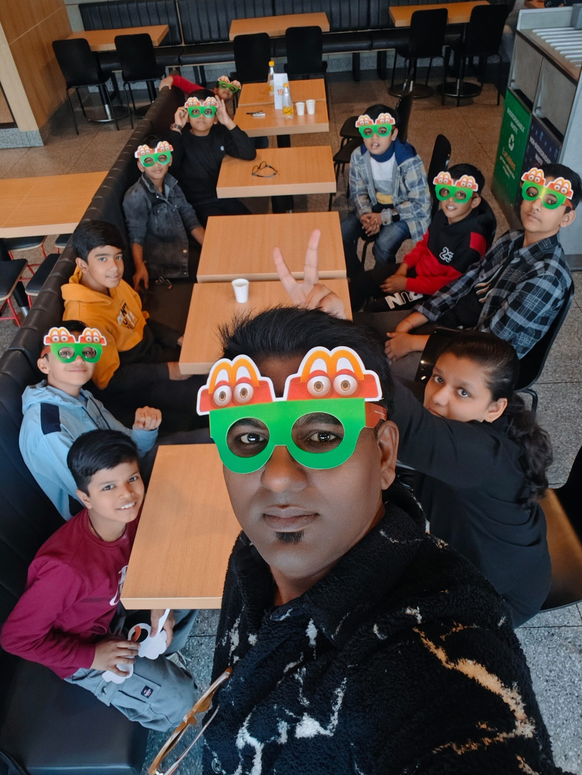 Young musicians and their mentor laughing and bonding over music and food