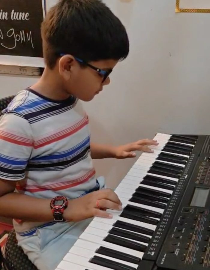 young pianist, RSL piano exam, piano practice, keyboard lessons, piano scales, piano melodies, beginner pianist, music education, RSL Debut exam preparation, piano performance.