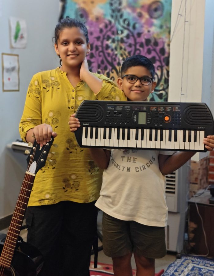 Ishi & Anwit – Young guitar-keyboard musical duo creating soulful melodies together.