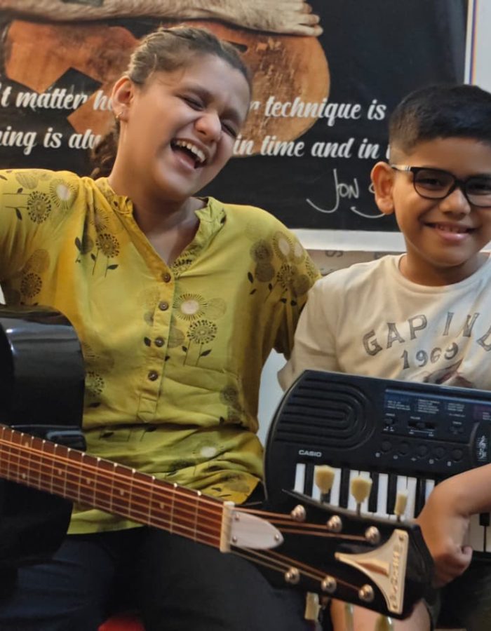 Ishi & Anwit – a young musical duo creating harmony with guitar and keyboard.